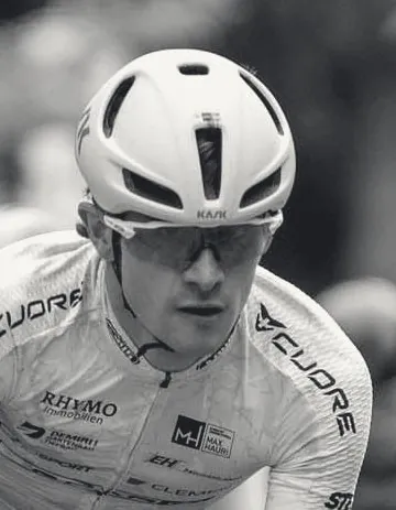 Black-and-white portrait of Manuel in helmet and glasses